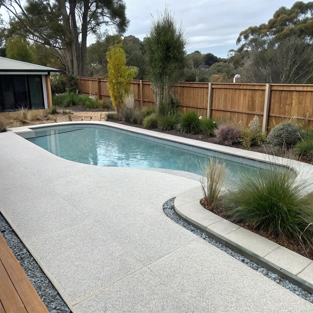 Finished epoxy pool deck coating on a Hobart residential property with light neutral tone